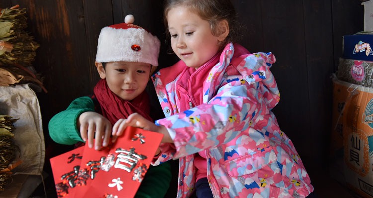 Giving Chinese New Year Red Envelopes to children