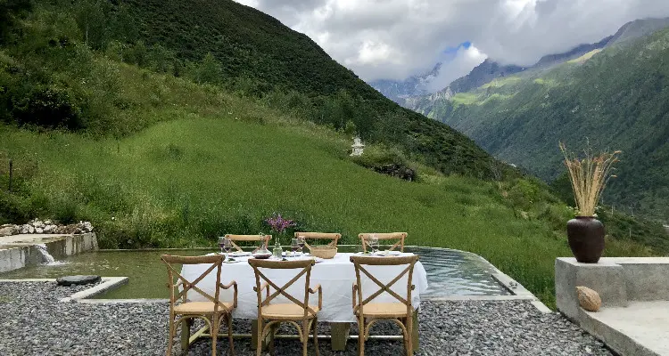 table with the view of the green mountains