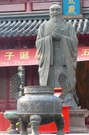 Confucius statue with an incense burner at a Confucius temple