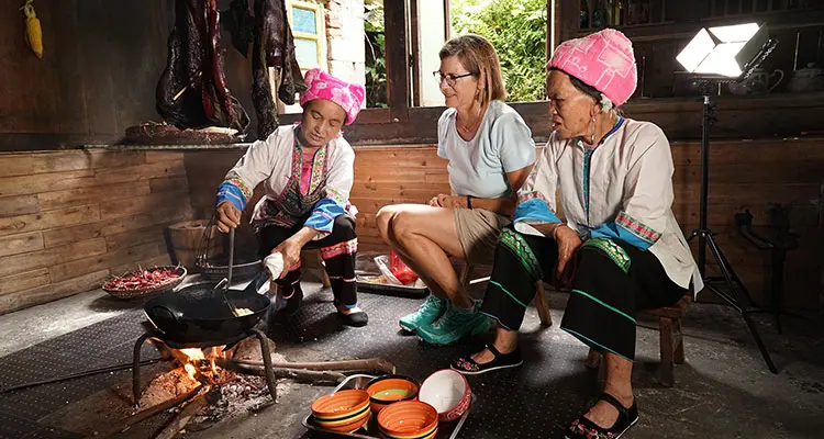 cook in the kichen with minority ladies